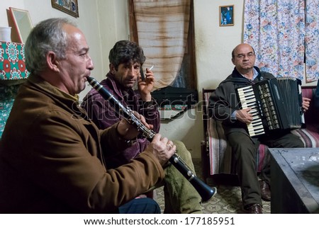 PRESPES LAKES, GREECE - DECEMBER 6, 2009: Two unidentified musicians play during a local festival at the Prespes Lakes, an important Transnational Park divided between Albania, Greece and FYROM.