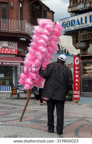 EDIRNE, TURKEY - MAY 6, 2014: An unidentified man sells pink sweets for the children. Seldom visited by tourists, Edirne is a pleasant historic city, full of monuments.