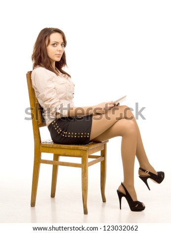 Attractive Woman With Crossed Legs Sitting On Wooden Chair - Isolated ...