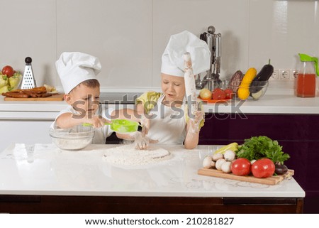 Serious White Little Chefs Baking SOmething to Eat in Kitchen