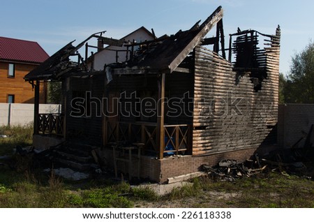 Extensive Fire Damage of Architectural Real Estate Property on Grassy Landscape Caused by Negligence.