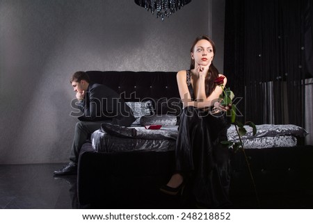 Young Lovers in Formal Wear Fighting for Something While Sitting at the Bedroom