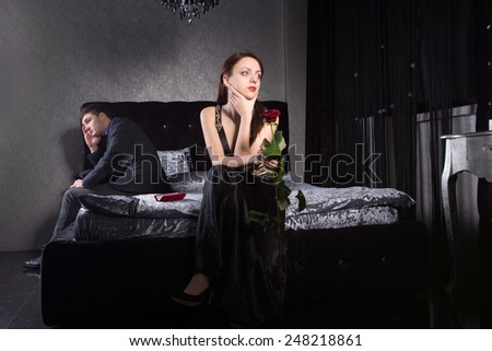 Young Couple in Formal Wear Having Relationship Issues While Sitting at the Bedroom.