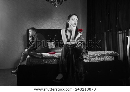 Young Couple Inside the Bedroom Fighting for Something. Captured in Gray Scale.