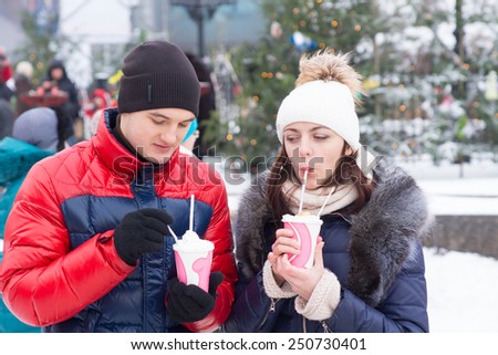 Close up Young Sweethearts with Winter Cup Drinks Having an Outdoor Date.