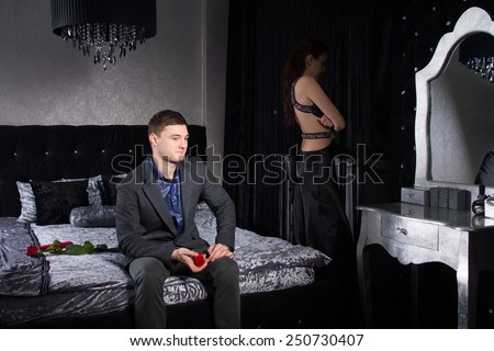 Young Couple in Formal Attire, Staying at the Bedroom, not in Good Terms