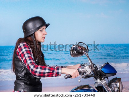 Close Up Profile of Young Woman Wearing Helmet Riding Motorcycle on Beach