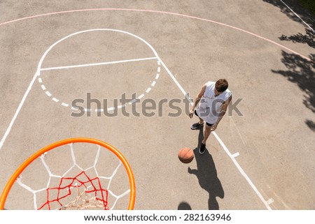High Angle View of Young Man Playing Basketball, View from Above Hoop of Man Dribbling Basketball