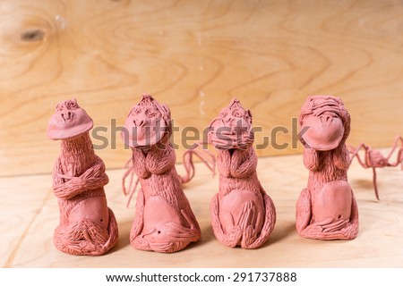Detail of Four Seated Monkeys Handcrafted from Red Clay - See No Evil, Hear No Evil, Speak No Evil