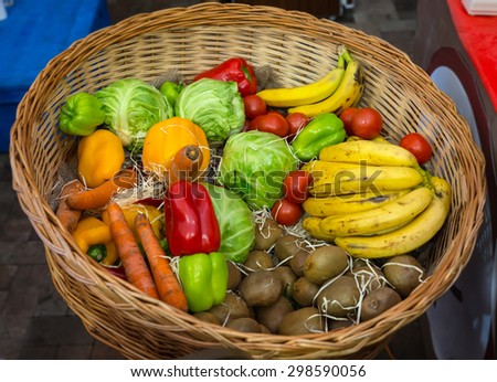 High Angle View of Woven Basket Filled with Fresh Fruits and Vegetables - Bright and Colorful Produce in Wicker Basket