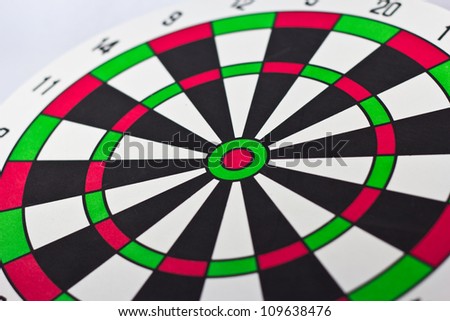Dart board with darts on white background