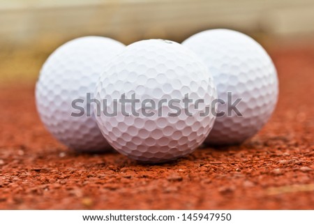 Close up golf ball on the ground.