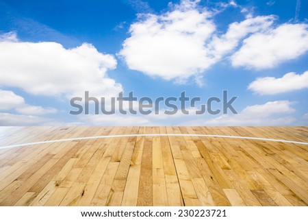 Basketball court with blue sky