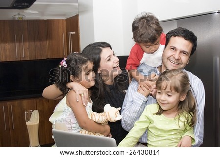 Portrait of beautiful family cooking in kitchen, dad, mom, daughters and little boy