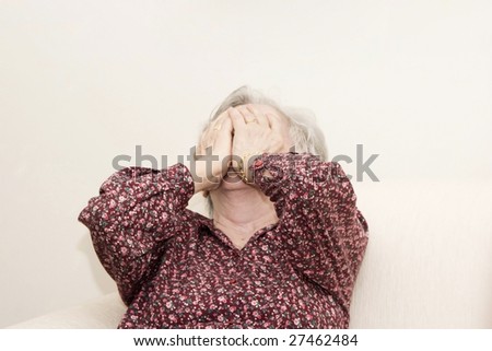 Portrait of family, crying old woman sitting
