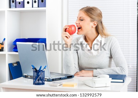 Beautiful businesswoman is eating healthy at work,Healthy snack