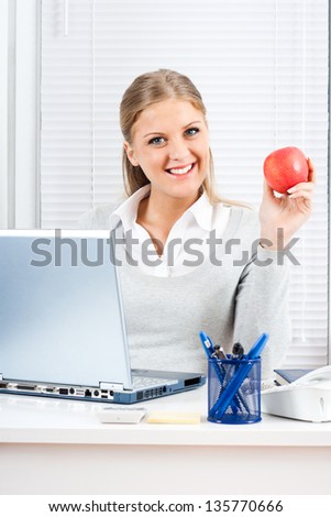 Beautiful businesswoman is eating healthy at work,Healthy snack