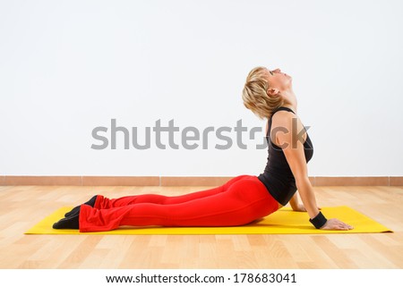 Young woman practicing yoga,Yoga-Bhujangasana/Cobra Pose