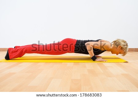 Young woman practicing yoga,Yoga-Chaturanga Dandasana/Four-limbed staff pose