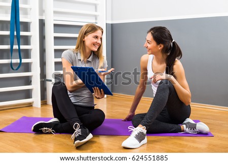 Similar – Image, Stock Photo Fitness woman consulting her training on her smartphone sitting in a jump box in the gym