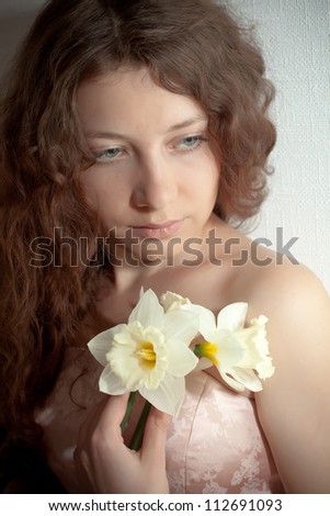 closeup portrait of beautiful woman with narcissus