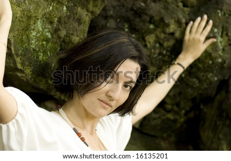 portrait of pretty unhappy woman in the cave