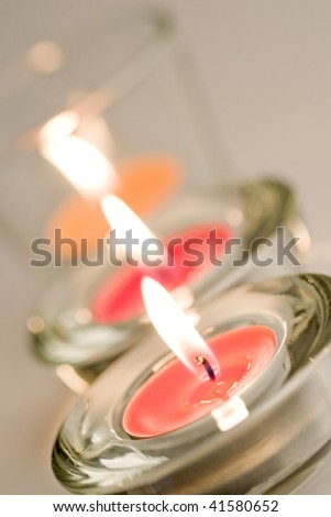 three candles flaming closeup