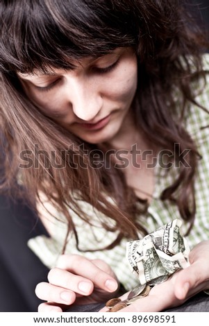 begging young woman with some money in her hands
