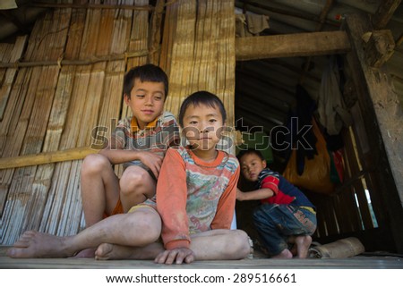 MUCANGCHAI, VIETNAM - June 11: unidentified H\'mong ethnic minority kids relaxing in ethnic\'s house when their parents are working on the terraces on June 11, 2015 in Mu Cang Chai, Yen Bai, Vietnam