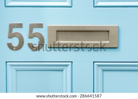 Door number 55 fifty five and letterbox conceptual image