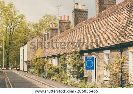 \'To Let\' sign beautiful row of cottages, Cambridge, England