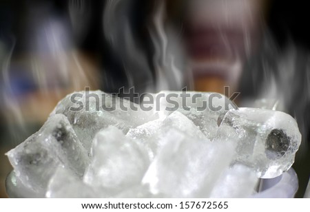 cold ice cube with white smoke