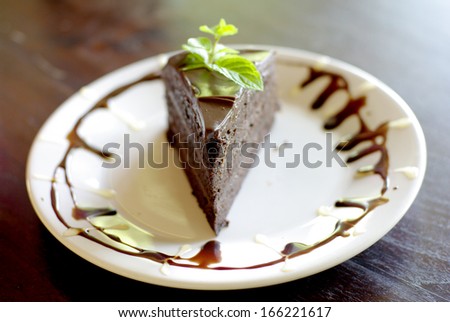chocolate fudge cake on decorated plate