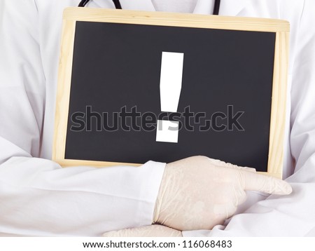 Doctor shows information on blackboard: exclamation point