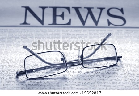 smart glasses on newspaper page. top news