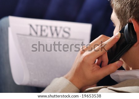 hot news reading. businessman learn  information on newspaper. note: \