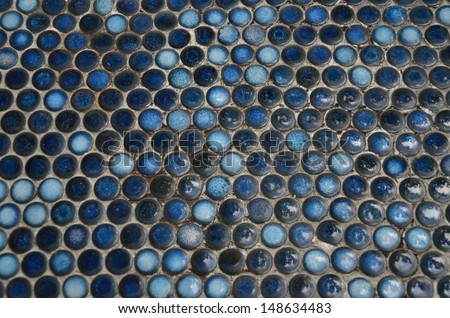 Blue buttons at concrete floor texture