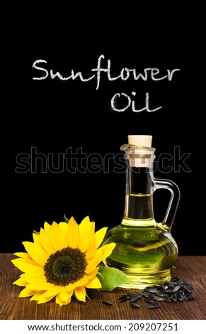 sunflower oil with sunflower by blackboard with inscription