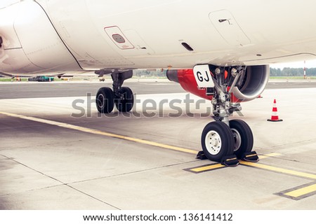 Landing gear and undercarriage of a jet airplane parked