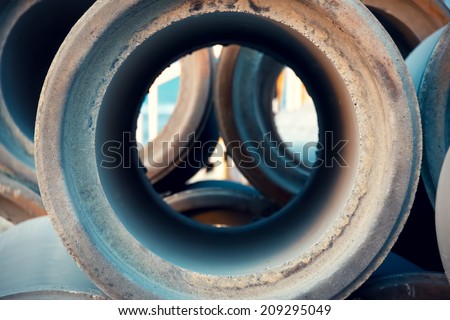 Empty and unused sewage pipes close up, pattern and industry background