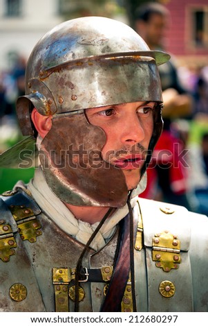 LJUBLJANA, SLOVENIA - AUGUST 24, 2014: Roman soldier in body armor with helmet, celebrating 2000 years of the first Roman settlement called Emona, today Ljubljana, Slovenia.