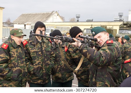 TVER, RUSSIA - MARCH 24, 2015: Cadets watchs weapon at the open day at the military unit