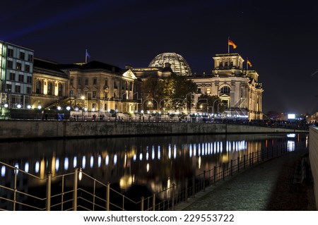 BERLIN, GERMANY - November 8, 2014 Lights border of illuminated balloon wall in Germany celebration of the people of the 25th anniversary of the fall of the Wall in Berlin near Reichstag and Spree