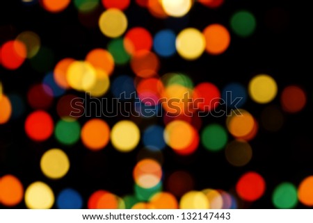 Multicolored Christmas tree lights bokeh and sparkles