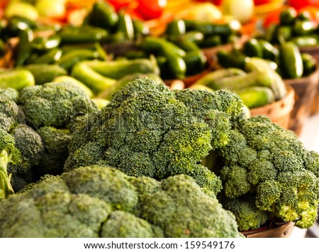 Bunches of organically grown broccoli for sale at local farmers market