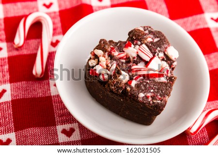 Close up of heart shaped piece of candy cane fudge