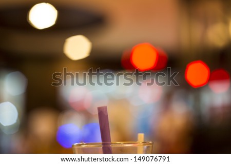 glass edge and suction tube with bokeh background