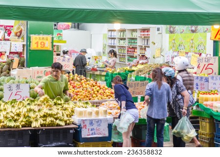 NEW TAIPEI CITY, TAIPEI, TAIWAN. NOVEMBER 2, 2014. Traditional street market in Taiwan with vendors selling street food.