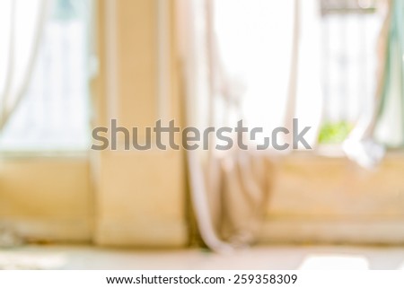 Abstract background of room windows with hanging curtains, shallow depth of focus.