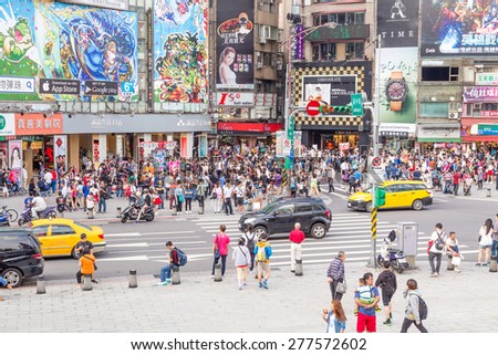 TAIPEI, TAIWAN - MAY 10, 2015: Crowds of shoppers and tourists in the Ximending District, the center of fashion and culture for young people.